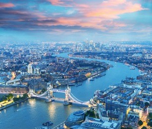 london at night. aerial view of tower bridge area and city lights.