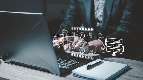 businessman checking data transfer using laptop computer with data server storage icon for data exchange and transfer concept.