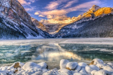 winter sunrise over scenic lake louse in banff national park, alberta canada