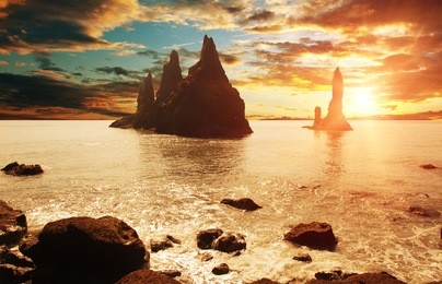 reynisdrangar rock formations near vik at sunset, iceland