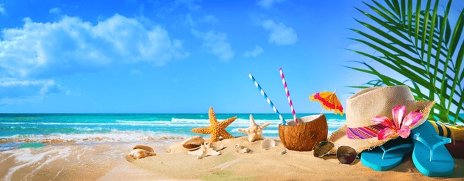 straw hat and sunglasses on beach. summer holidays concept