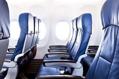 empty airplane seats in the cabin