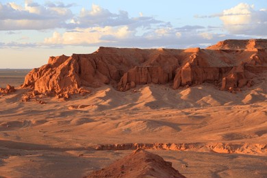 the rock formations of bayanzag flaming cliff at sunset, mongolia