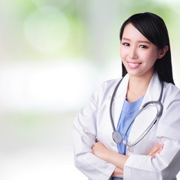 young doctor woman smile face with stethoscope with nature green background, asian female beauty