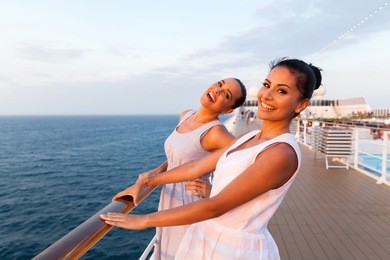 cheerful two women having fun on cruise ship