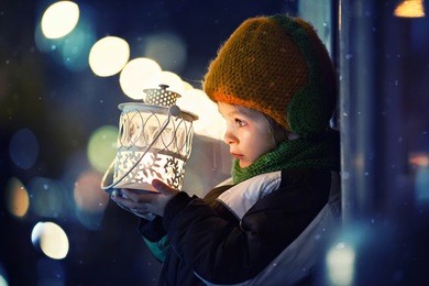 cute boy, holding lantern outdoor, wintertime