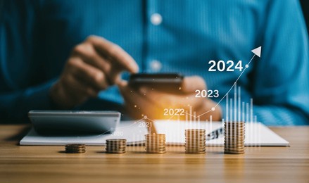 financial business growth 2024, businessman analysis profitability of working companies with digital augmented reality graphics, businessman calculating financial data for long-term investments