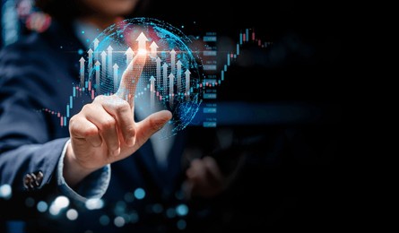 businesswomen point to virtual screens of graph stock market changes in the global interface, uptrends, growth economic, business strategy development, and find opportunities for investment.