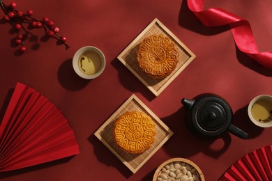 background for advertising mooncakes on mid-autumn festival occasion. layout of tea table party with delicious mooncakes decorated. reunion tet is in the 8th lunar month every year