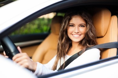 young woman driving her car