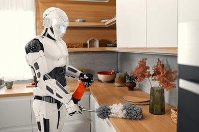 robot housekeeper doing cleaning in the kitchen. robot assistant. living together between humans and artificial intelligence.