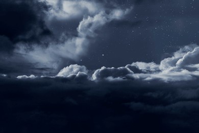dark cloudy night sky with stars