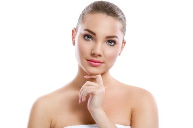 lovely young woman with perfect skin over white