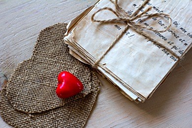 vintage love letters and hand made heard on old board
