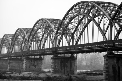 the iron "gerola bridge" on the po river, lombardy (northern italy, in the province of pavia). black and white photo