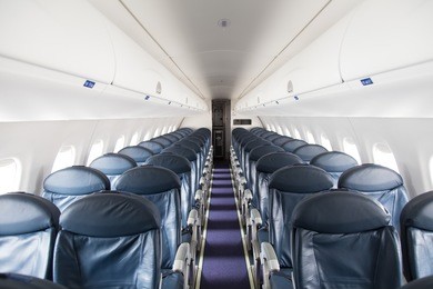 dark blue seats in a empty jet airplane