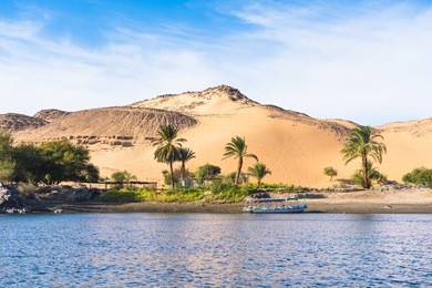 sunset, sand dunes on the coastline of the nile river part called first cataract, aswan, egypt