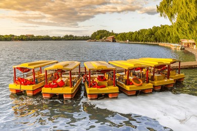 colorful pedal boats at the jetty in beihai park in beijing, china