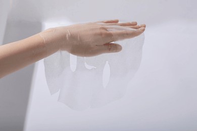 use transparent facial mask cloth to display skin care products