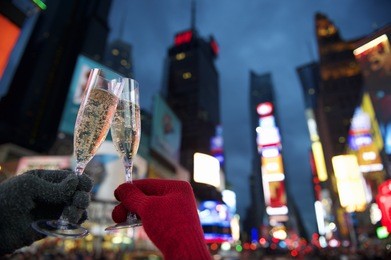 happy new year champagne toast couple in times square new york city