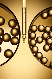 golden dropper skin care product essence texture symmetry scientific vessel