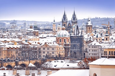 snow in prague, rare cold winter conditions. prague castle in czech republic, snowy weather with trees. city landscape from beautiful town. winter travelling in white europe.