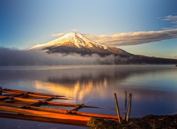 mount fuji reflected in lake yamanaka at dawn, japan.