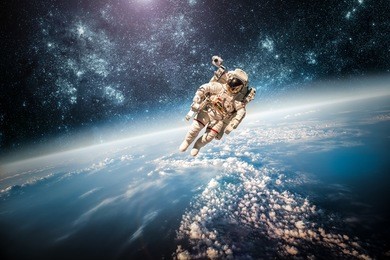 astronaut in outer space against the backdrop of the planet earth. elements of this image furnished by nasa.