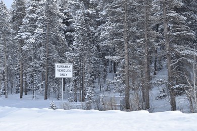 runaway vehicle sign off of snow covered colorado highway