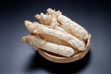 dried bamboo mushroom in a bamboo basket. dictyophora indusiata