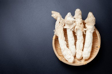 dried bamboo mushroom in a bamboo basket. dictyophora indusiata. top view