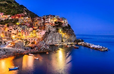 night view of manarola, one of the five villages of the cinque terre on italy mediterranean coast.