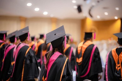 rear view of graduates at the university graduation ceremony