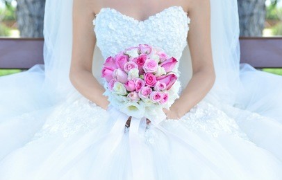 bride holding flower bouquet 