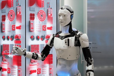 humanlike robot with high-tech design standing against digital backdrop, symbolizing advanced ai and robotics.