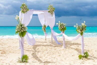 beautiful wedding arch, cabana on sand beach, outdoor beach wedding