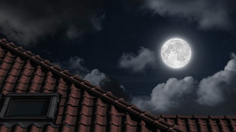 roof of the house under the night blue sky