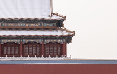 tower building in forbidden city, beijing, china, with snow