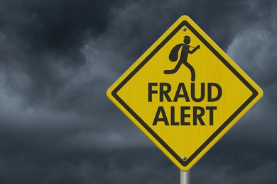 fraud alert message with scammer on warning road sign with stormy sky 3d illustration 