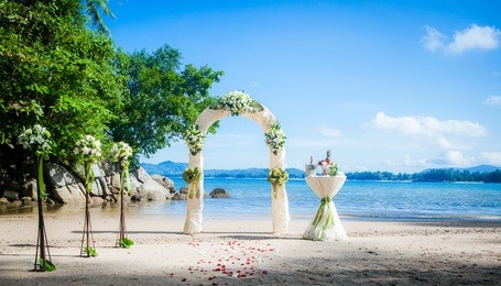 wedding ceremony on the shore of the ocean sea arch on the beach