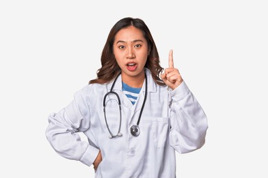 a young asian doctor woman having an idea, inspiration concept.