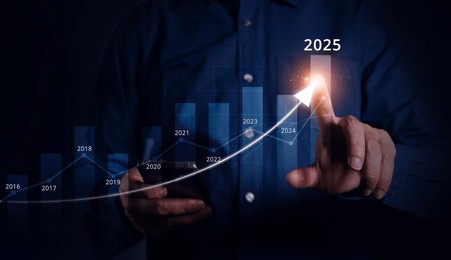 businessman using smartphone pointing at increasing arrow graph, future business goals of company in 2025, planning and strategy, business development concept