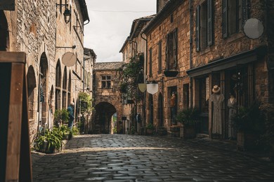 old cobblestone medieval road in the town, the village of cordes-sur-ciel in france