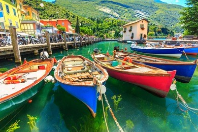summer landscape and wooden boats,lake garda,torbole town,italy,europe