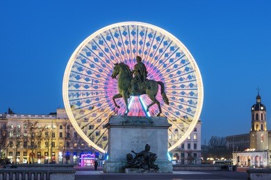 place bellecour statue of king louis xiv by night, lyon france 