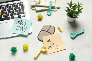 carton mouse, sticky notes and balloons on white background. april fools day prank