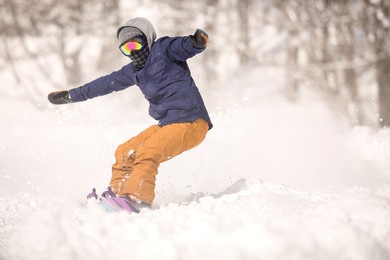 image of a man snowboarding
