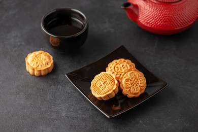 homemade mooncake.  chinese bakery product traditionally eaten during the mid-autumn festival. homemade baked yue bing filled with nuts and dried fruits