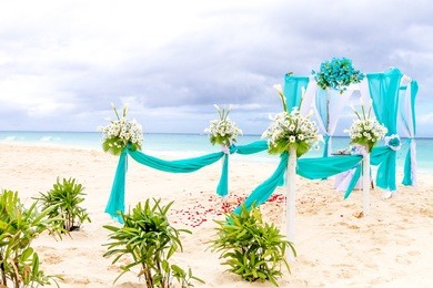 beautiful wedding arch, cabana on sand beach, outdoor beach wedding