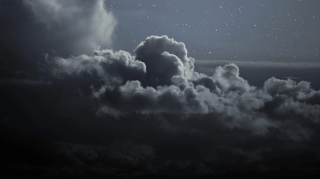 blue cloudy night sky with stars